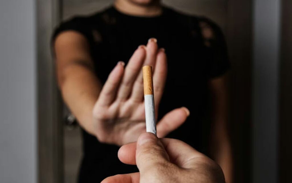 hand refusing cigarette